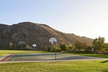 a basketball court with a mountain in the background at The Villas at Anacapa Canyon, Camarillo